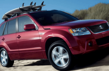 Suzuki Grand Vitara (2006-) Stereo Removal 38 Suzuki Vitara 2006 - Red with roof rack and surf board